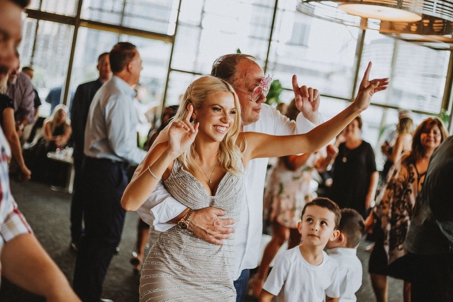 Party celebration with guests dancing and having fun on the dance floor.